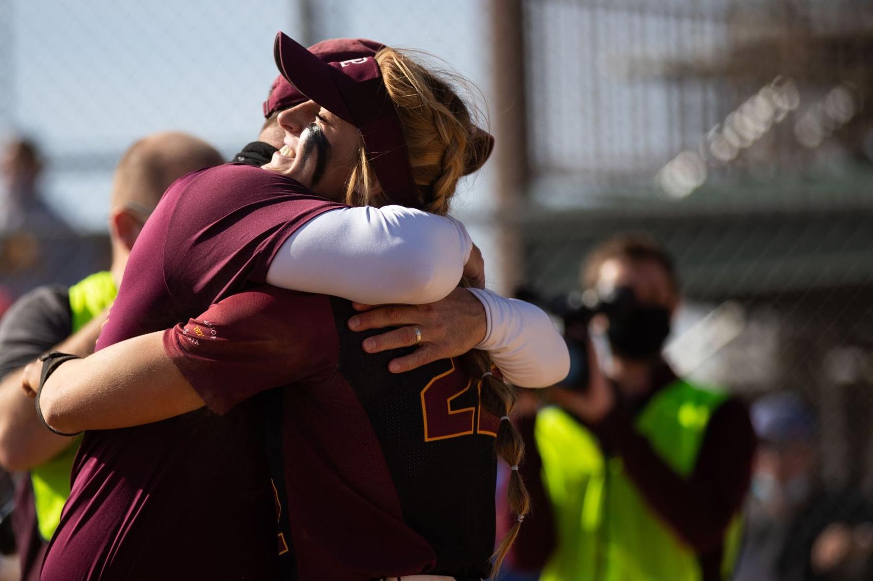 Pitcher Jordyn Bahl hugs Papillion-La Vista head coach Todd Petersen after winning the 2020 Class A championship. Photo - Lily Smith, the Omaha World-Heard copy