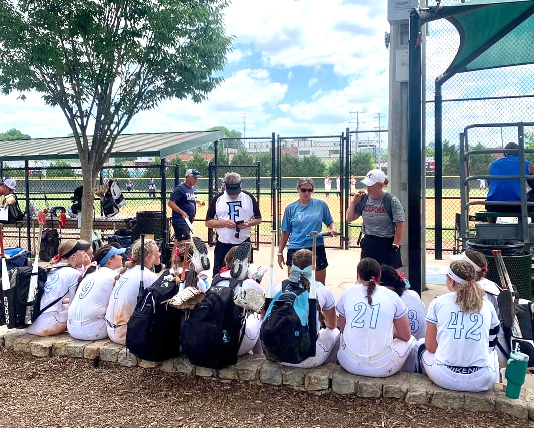 The Fury coaches and players huddle together after a gameJPG