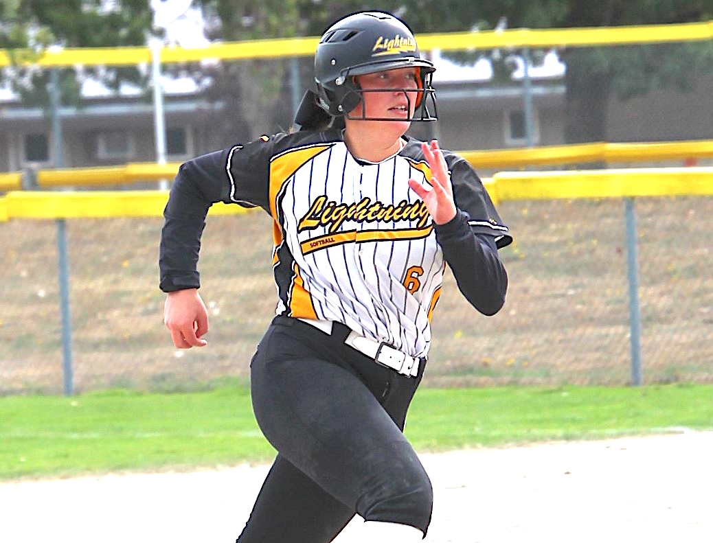 ACTION - Jocelyn Weger rounds second base headed for third