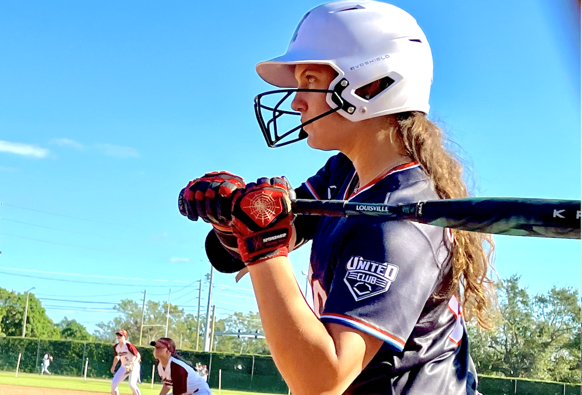 Danika Spinogatti waits on deck in a game where she would have a three-run home run