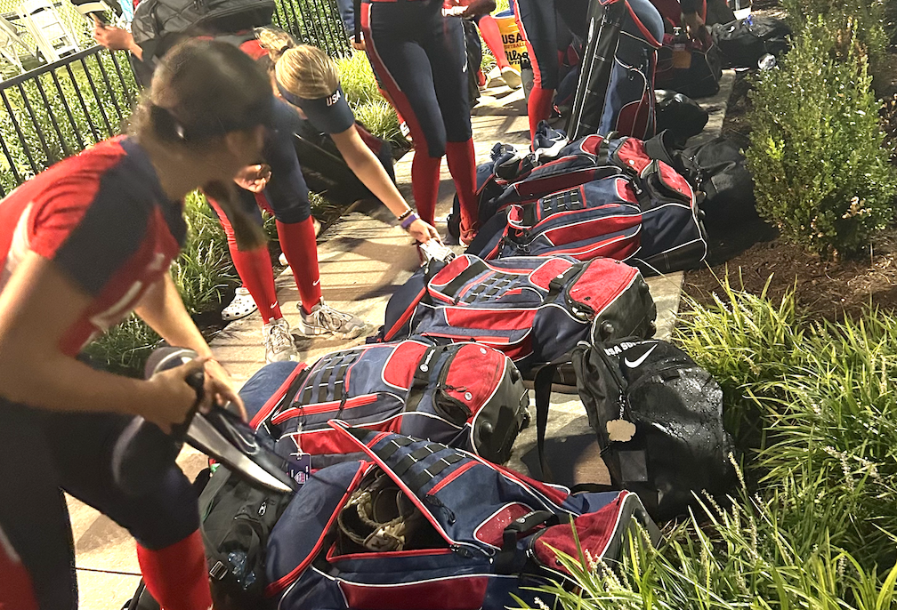 Ella McDowell pulls her mitt out to do Hacky after the Team USA win over Canada at the WBSC World Cup Group C championship in Dallas on Sept. 2, 2024.jpg