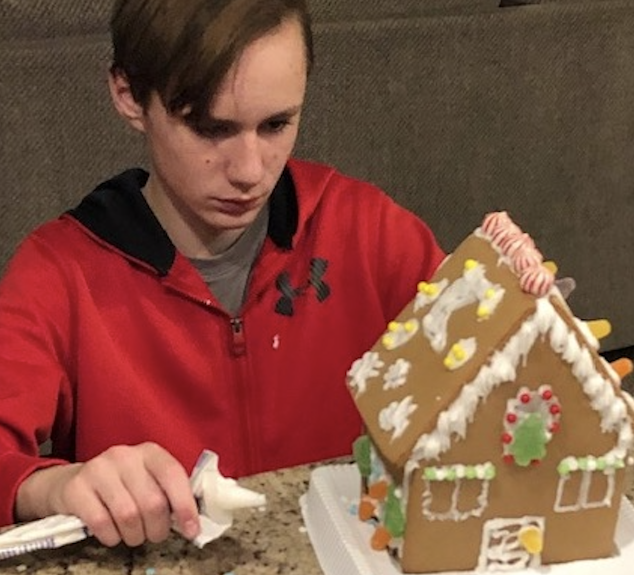 Kailen working on his gingerbreadhouse Christmas Eve 2019