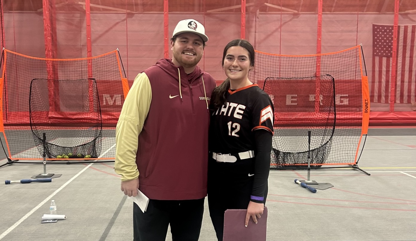 Rose Wendel posing with a coach from Florida State, one of the colleges at the Exposure Camp