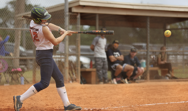 ACTION - 20 - Emma Thornton of EC Bullets - Jackson connects on the pitch.jpg