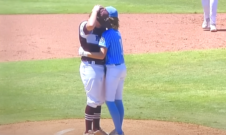 Little League opponents Kaiden Shelton (left) and Isaiah Jarvist embrace on the mound after a scary incident in 2022. Video and images courtesy of ESPN.jpg