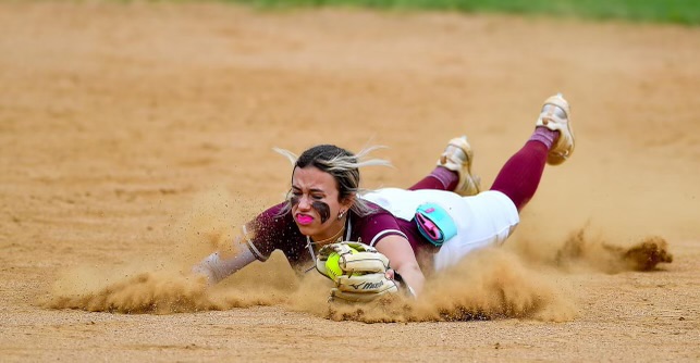ACTION.- ACTIoN - Tinley Goodson makes the diving catch for her Unity 16U team and gets a bit dirty in the infield.jpg