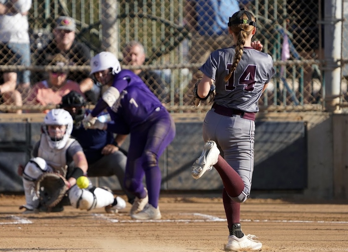 Sierra Murray pitches for her NW Bullets - Dawson:Muir team