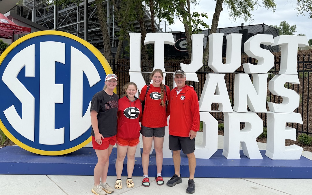 The White family at the SEC Tournament (l-r) Grace, her younger sister Abigail, Esther and their father Scott copy