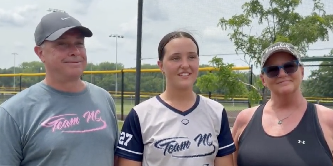 Kaylee Hodges, a 2027 pitcher who plays for Team NC – Bowman, with her parents at Wednesday's CONNECT Camp