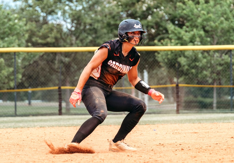 ACTIION - 84 - Charlet Reed with the Carolina Cardinals throws on the brakes on the basepaths