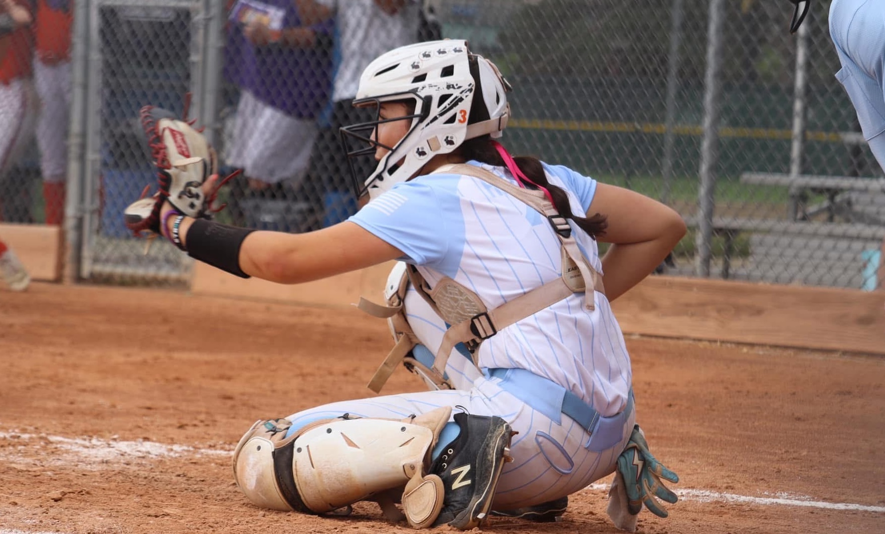 ACTION - 28 - Ella Harmon, a standout catcher for Fury Premier - Robinson, was named as a PGF All-American this year