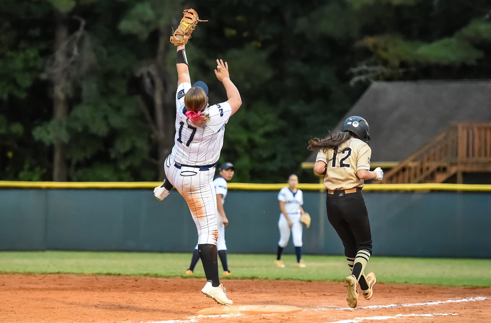 ACTION - 35 - Karsyn Plaisance makes the big stretch to get the out for her Impact Caymol Premier team.