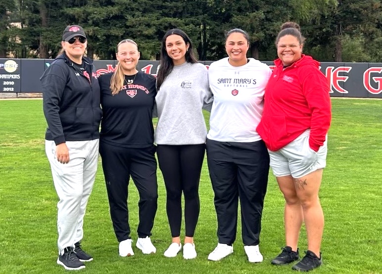 Izzy Frye (center) with the St. Mary's coaching staff