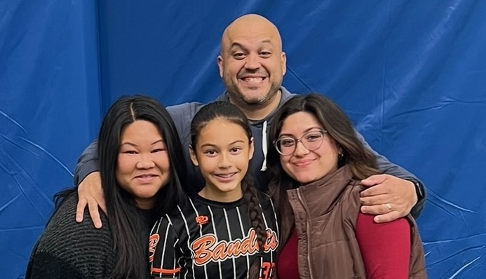 Lily in uniform with (l-r) her mother Heid, her father Erik and her sister Janesa in Chicago recently at the Bandit Friendly