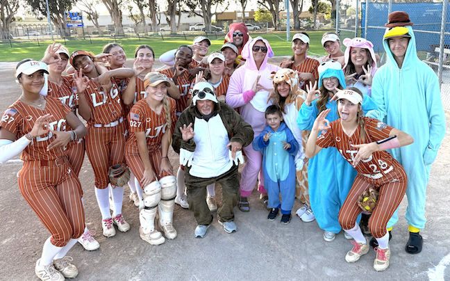 Players and family members of LTG pose Friday night in uniform and in costume!