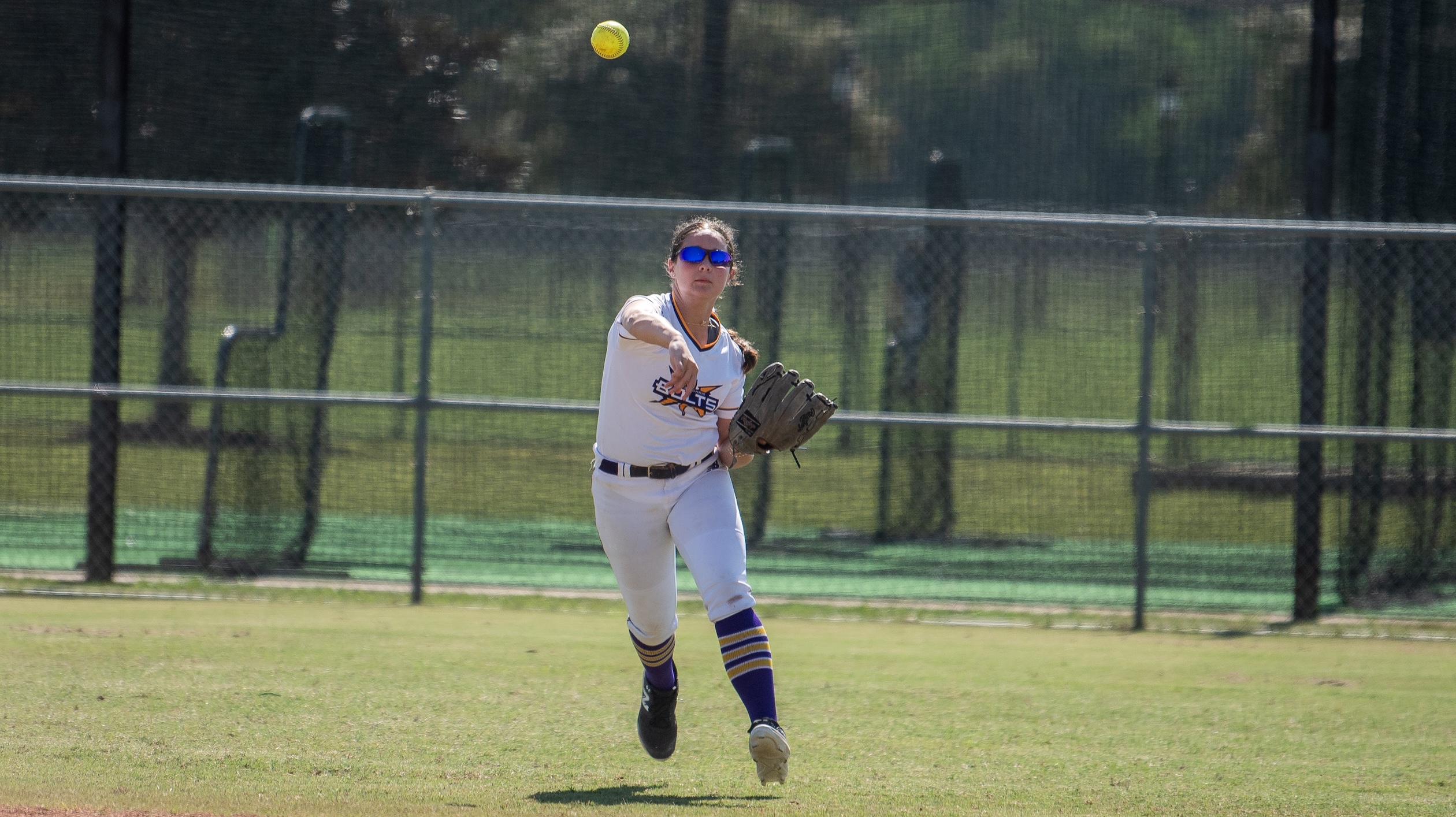 Avery Kate (AK) Wangaard, a Top 10 outfielder in the Class of 2031, makes a throw from the outfield for her Birmingham Thunderbolts - Tennyson team,