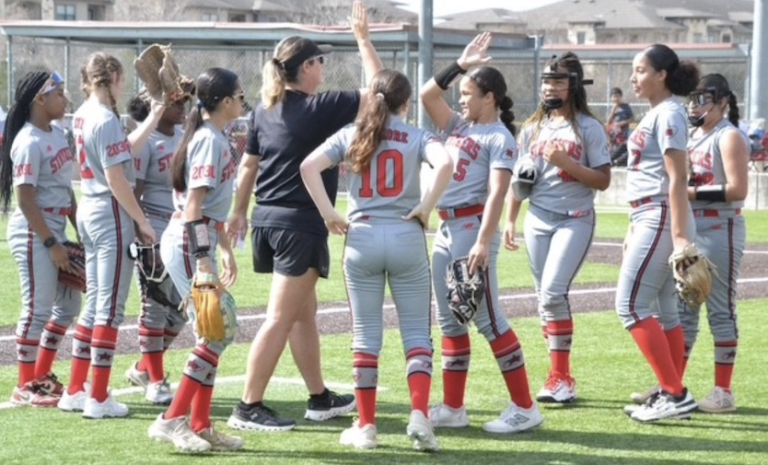 Cataline Cooper, a left hand pitcher, gets a high five as Coach Christa celebrates with her 2030 Strykers Gold 14U team
