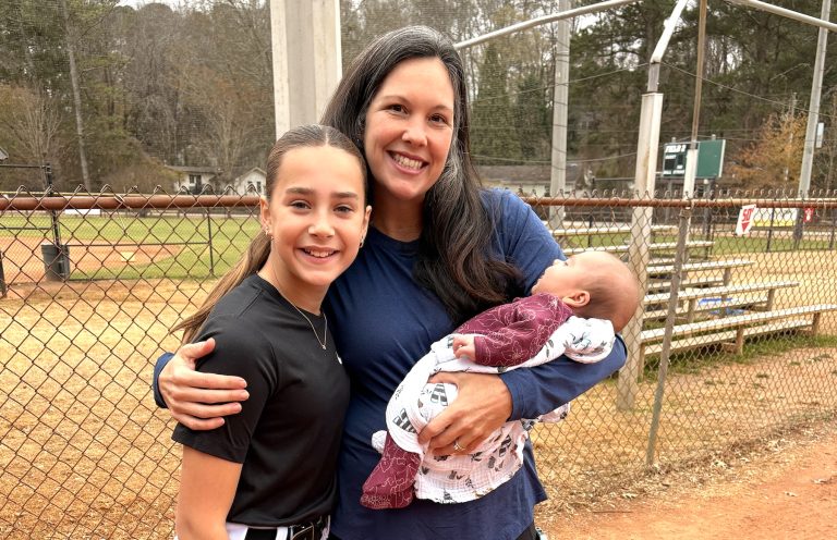 Jessica Bilz with baby Ruby and pitcher Cassidy Tartline who Jessica says is a future lefty stud!