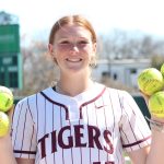 Lolo Gamble holding five of the six home run balls she hit in just 10 plate appearances last week!
