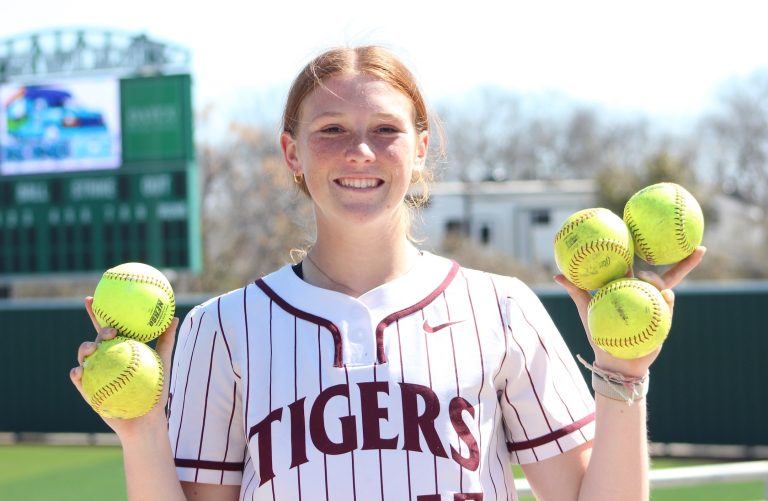 Lolo Gamble holding five of the six home run balls she hit in just 10 plate appearances last week!