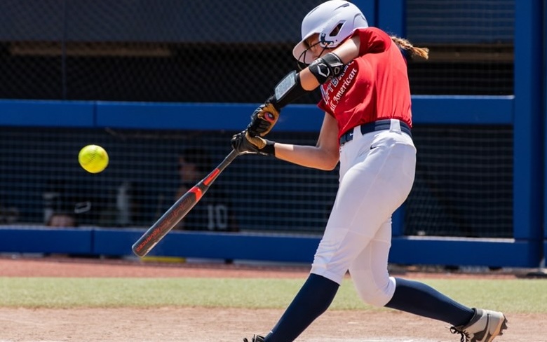 ACTION - 60 Mackenzie Gore, a 2030 infielder for Fusion Premier Ann, connects with the pitch at a USA Softball event