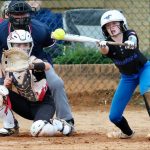 ACTION - Annie Cox, an outfielder for the Birmingham Mustangs 2030 team, reaches out to make the bunt