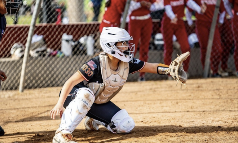 ACTION - Katie Cerda, from Salinas, Calif., behind the plate for the LTG - Carda:Madrigal team