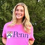 Ellie Goddard proudly flashes her future Penn Quakers logo