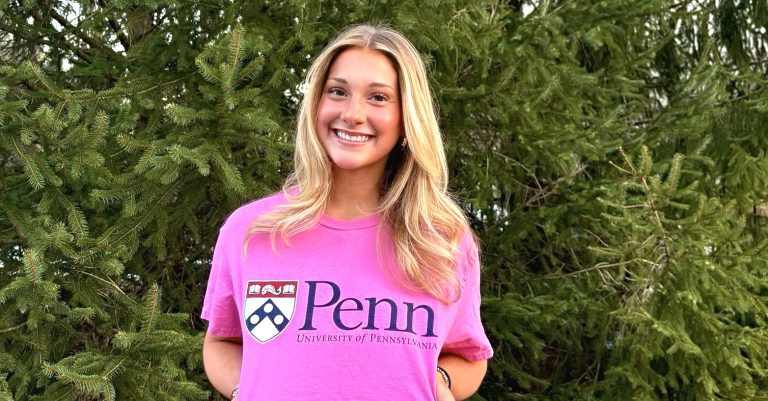 Ellie Goddard proudly flashes her future Penn Quakers logo