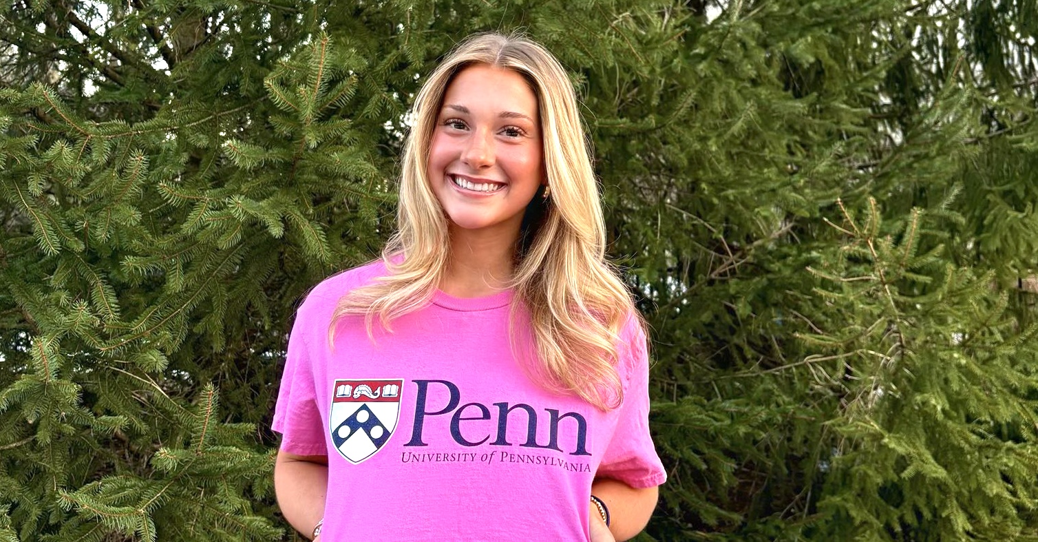 Ellie Goddard proudly flashes her future Penn Quakers logo