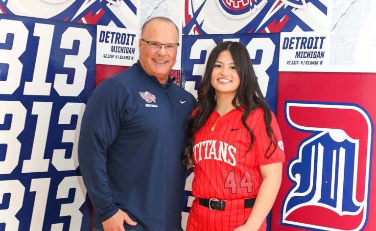 Lively Hanawalt, a 2027 third baseman and catcher for the Ohio Wolff teamk poses with Detroit Mercy Head Coach Dan Vitale on her campus visit to the Horizon League to the Horizon League university