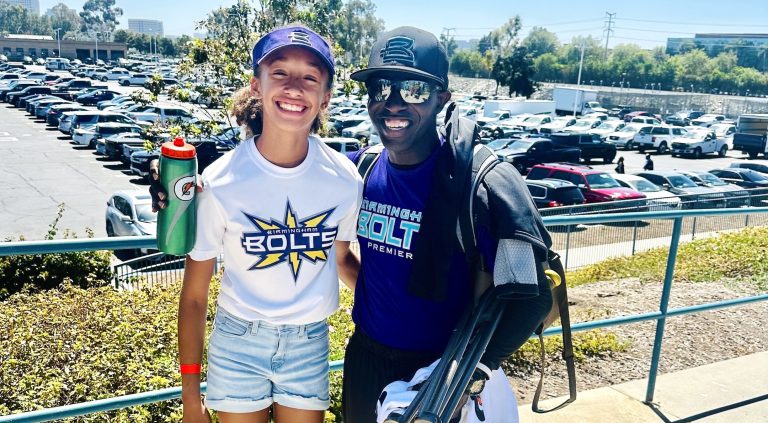 2031 pitcher Esther Young with Birmingham Thunderbotls head Rock Thompson