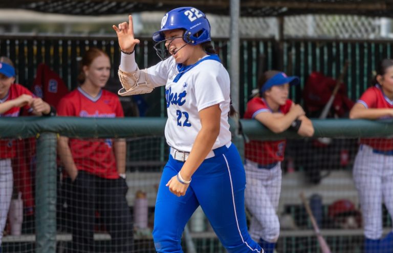 Karmen Vazquez flashes the L for LSU, her future college home, after hitting a home run last week for her Hanford (Calif.) West team