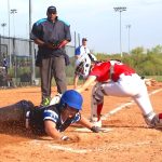 ACTION - 77 - Madeline Pochos of the Lady Dukes Chicago 2029 team beats the tag at home plate.