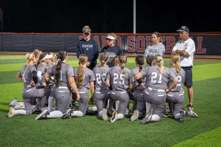 Head Coach Kelly Reynolds speaks to her Spartans team