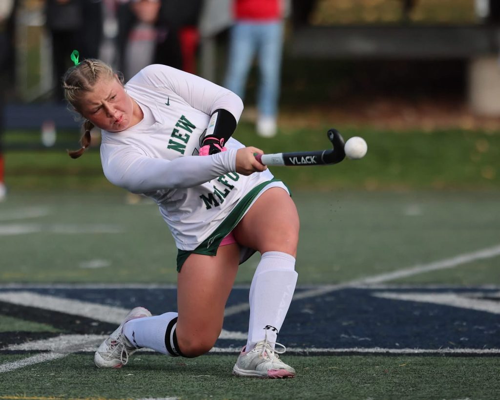 Cienna executes a lift during the CIAC Class M State Championship field hockey game.