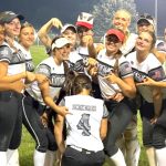 The Outlaws 16U - Wolff:Acord players point to Natalia Scekeres's No. 4 jersey to signify the team made to the Final Four of the Colorado IDT tournament