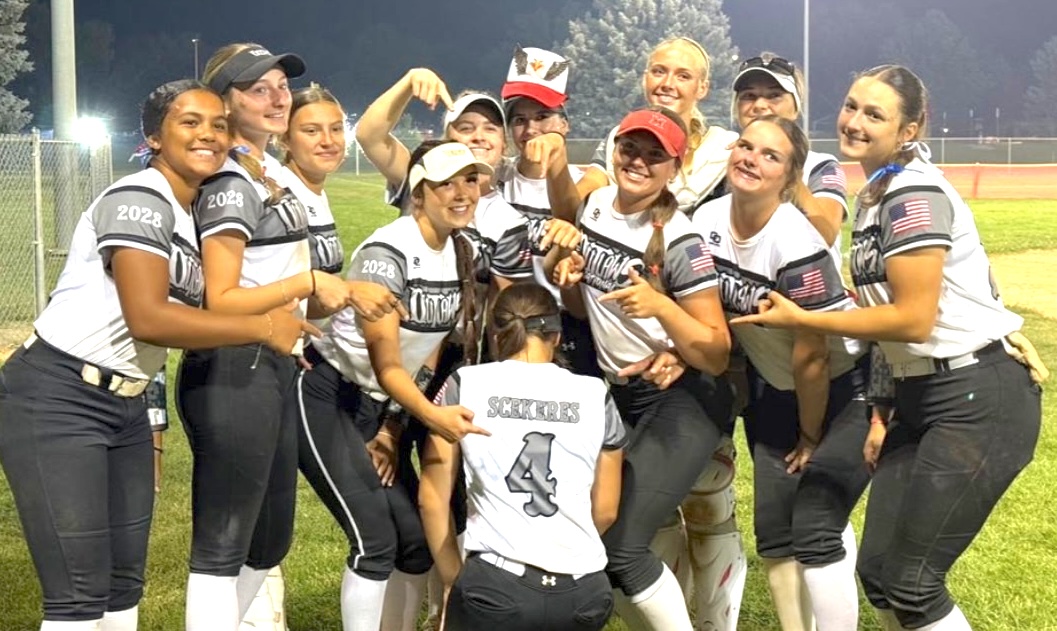 The Outlaws 16U - Wolff:Acord players point to Natalia Scekeres's No. 4 jersey to signify the team made to the Final Four of the Colorado IDT tournament