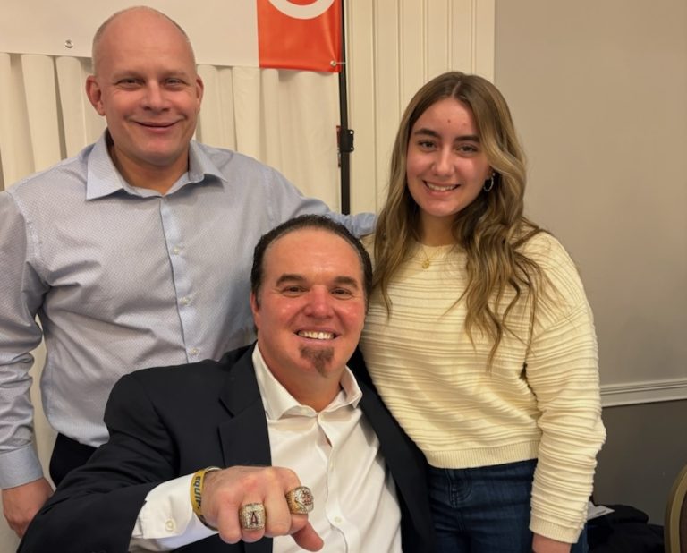2028 utility player Gida Juritza (right) with her father, Rob Juritza, and her cousin, Scott, a two-time World Series champion