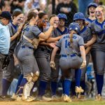 ACTION - Anna Hurst is greeted at home by her high school teammates at Tuscarora (Va.) High