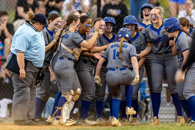 ACTION - Anna Hurst is greeted at home by her high school teammates at Tuscarora (Va.) High