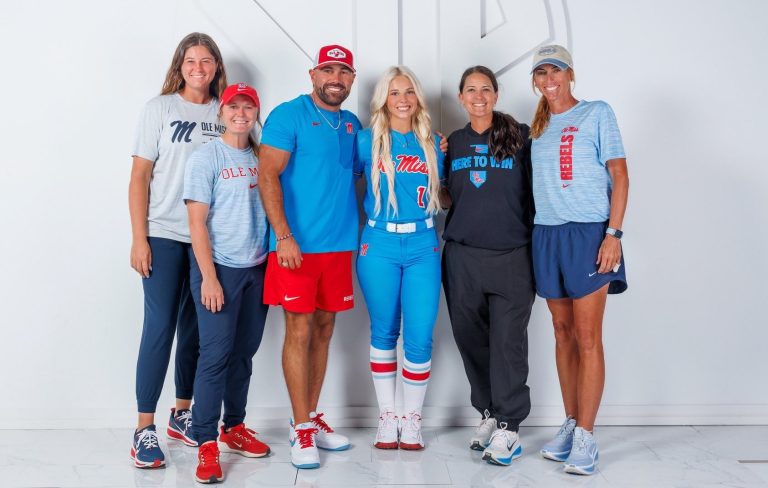 Adair Amsler (in uniform) with the Ole Miss coaching staff (l-r) Brooke Vestal, Morgan Klaevemann, Bobby Buchanan, Jamie Trachsel and Nancy Evans