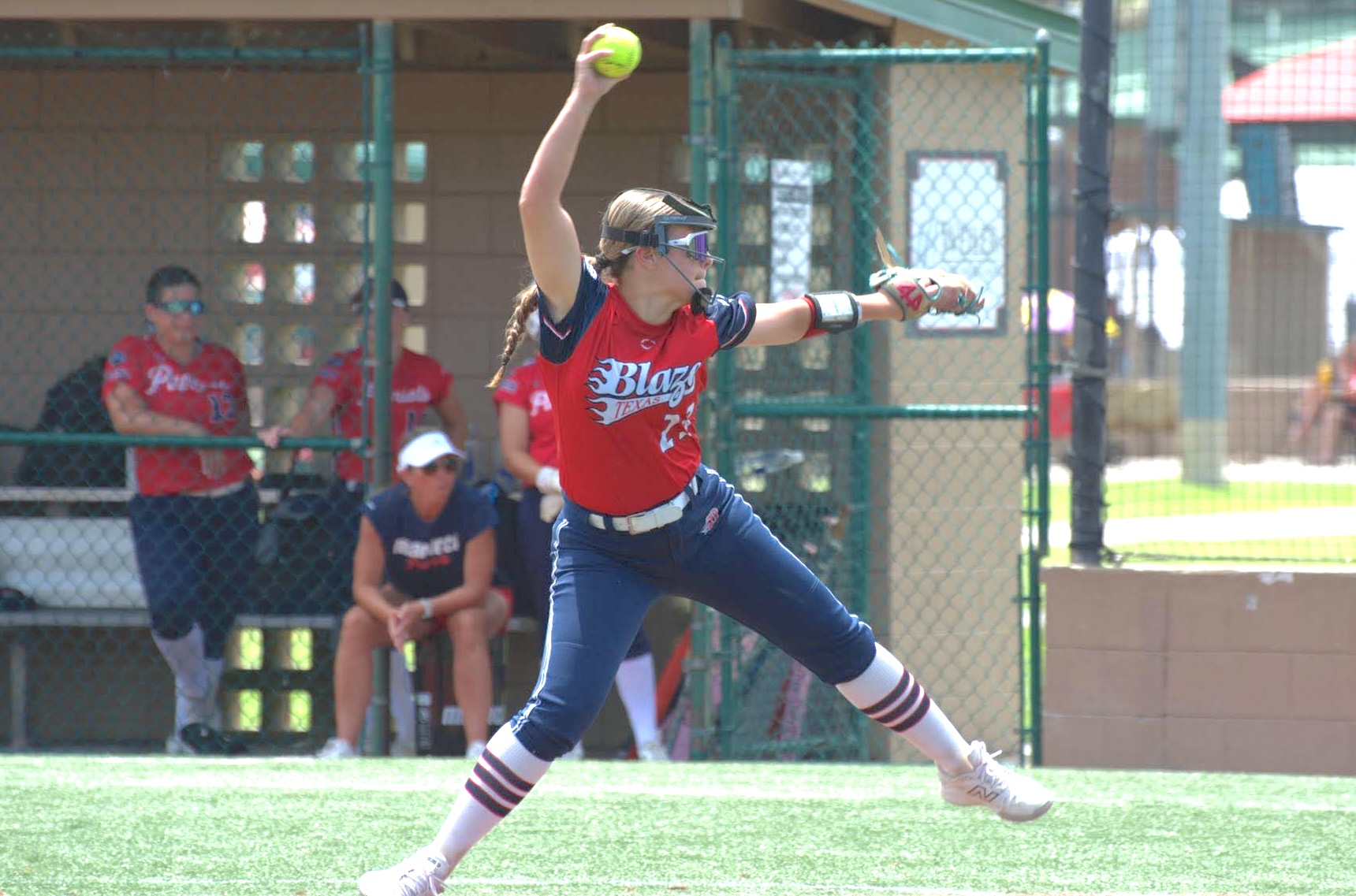Bella Perez mid-wind up for her Texas Blaze team