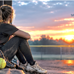 Girl looking off into the sunset