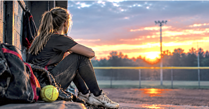 Girl looking off into the sunset