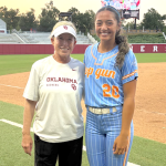Grace Tonga, the 2028 outfielder with Top Gun - Sciara, is pictured here with Head Coach Patty Gasso of Oklahoma in June at a prospect camp on the Sooners' campus.