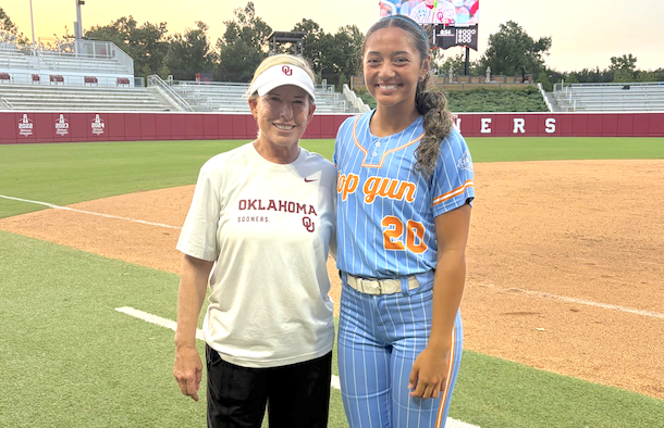 Grace Tonga, the 2028 outfielder with Top Gun - Sciara, is pictured here with Head Coach Patty Gasso of Oklahoma in June at a prospect camp on the Sooners' campus.