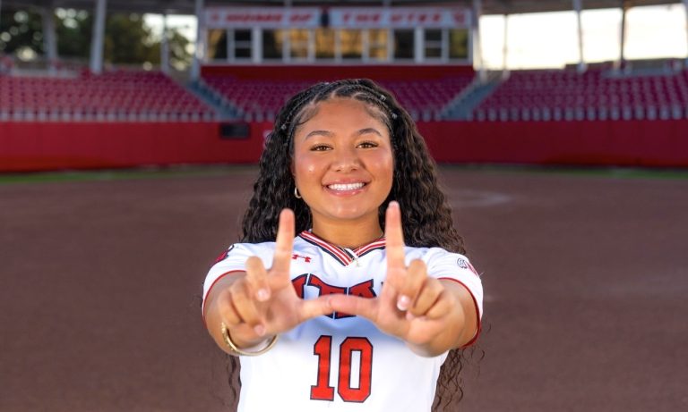 Nia Talataina is pictured "Flashing the U" on her official campus visit to the the University of Utah recently