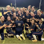 The East Forsyth High team celebrates its big win, pointing to standout senior pitcher Caitlin Martinez, after knocking off defending Georgia 5A state champion Eastside High