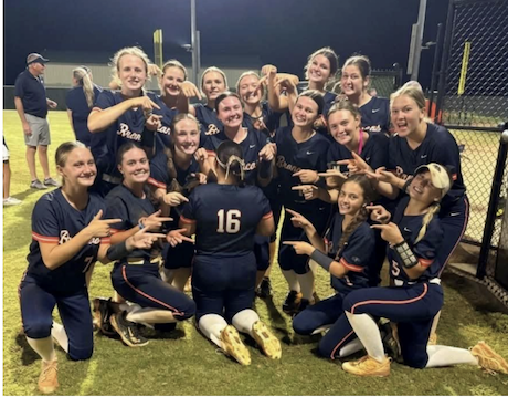 The East Forsyth High team celebrates its big win, pointing to standout senior pitcher Caitlin Martinez, after knocking off defending Georgia 5A state champion Eastside High